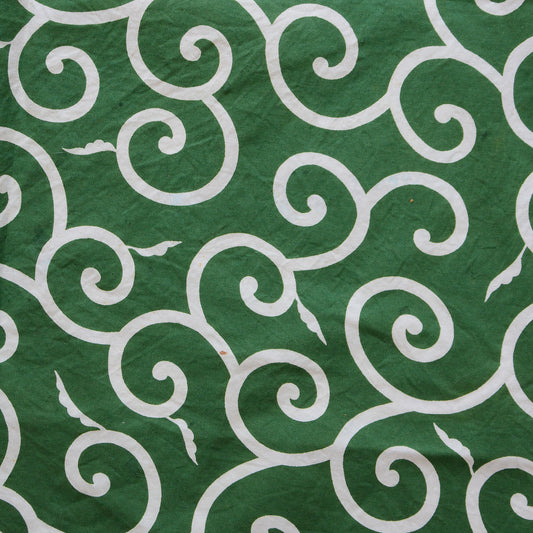 Green furoshiki cloth with traditional Japanese karakusa pattern