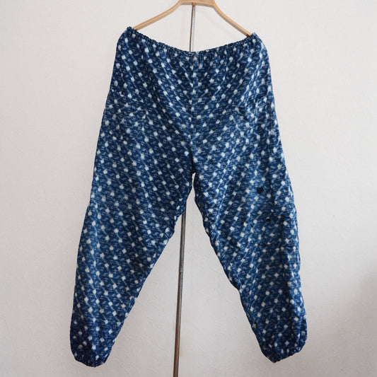 Monpe pants made from indigo-dyed kasuri cotton with boro repairs