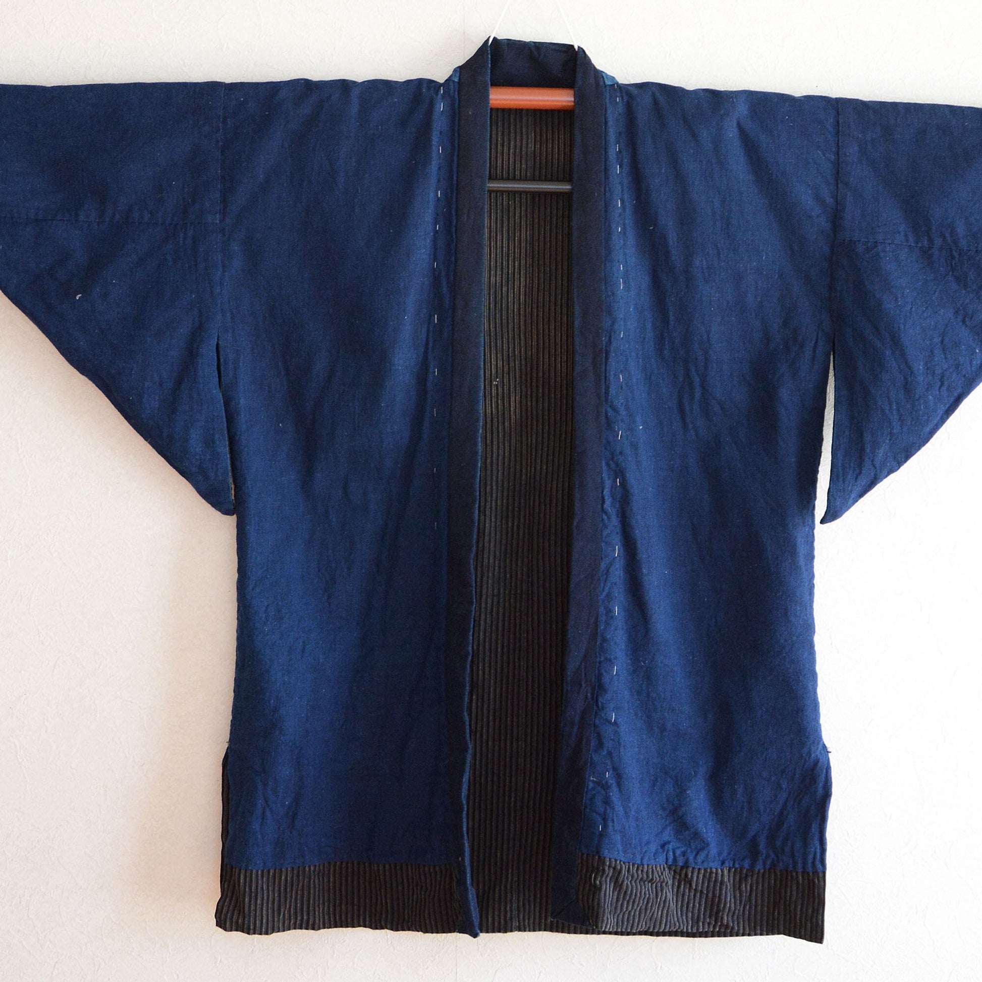 Front view of indigo-dyed Japanese Noragi jacket with visible texture