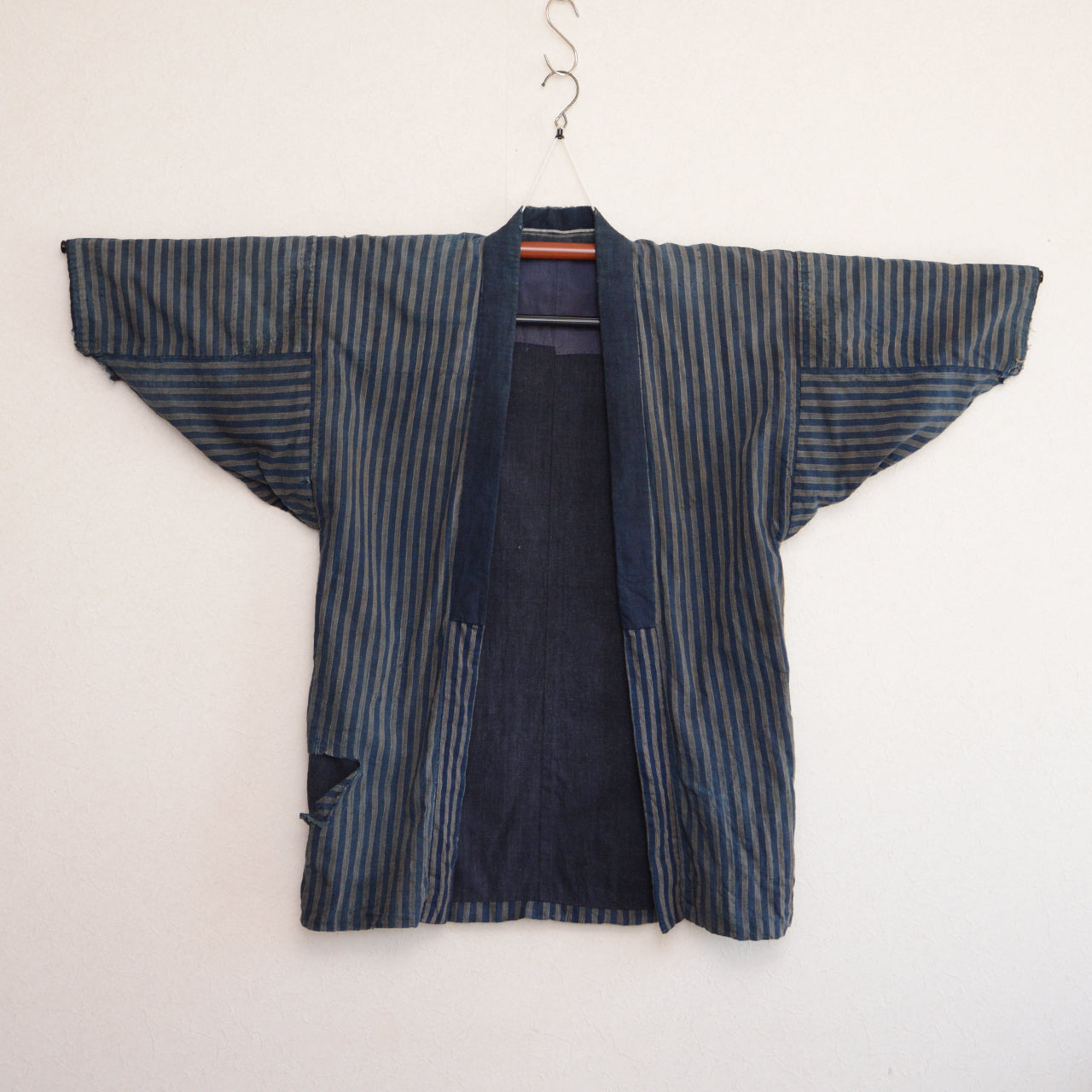 Indigo dyed cotton noragi with crazy pattern lining