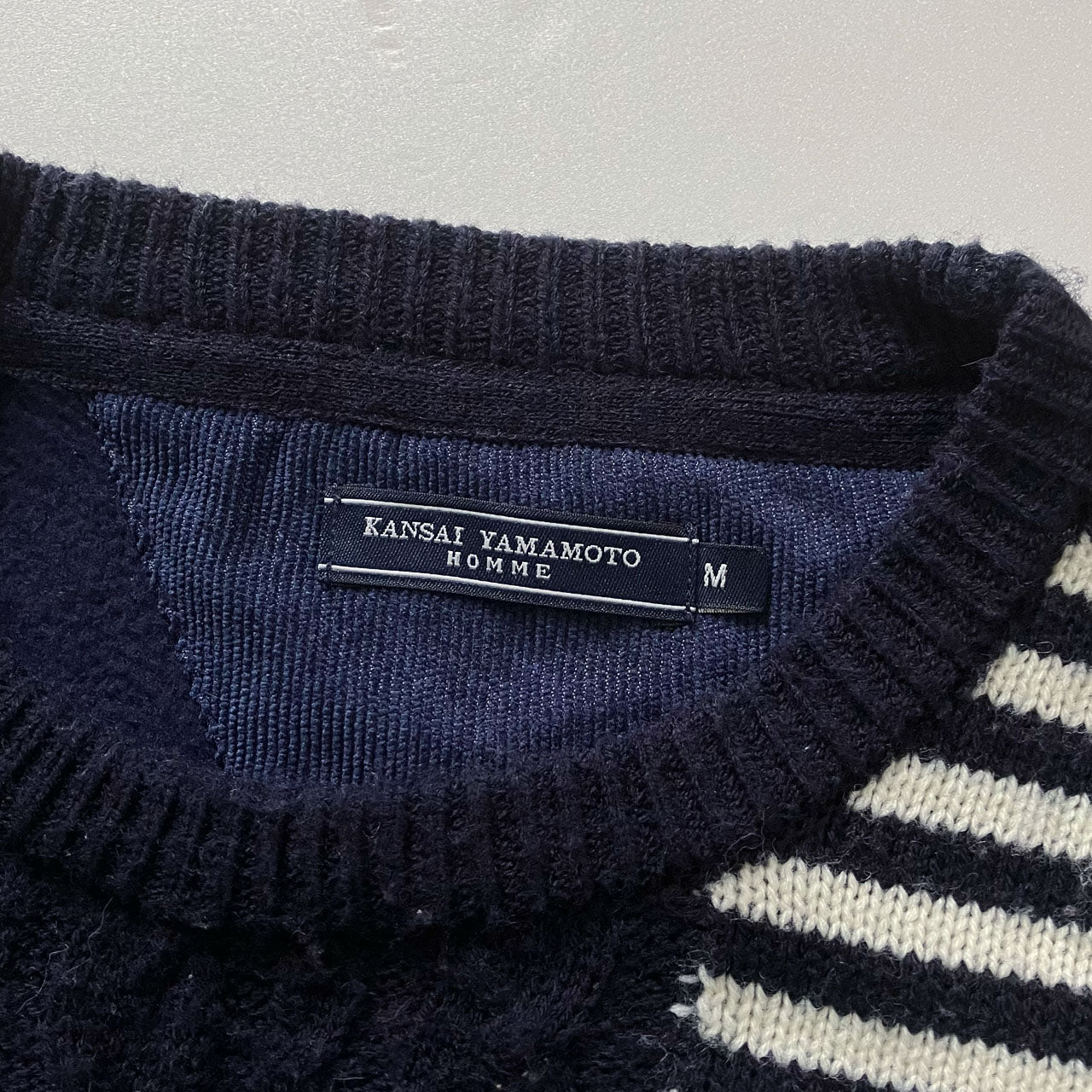 Vintage-style mixed knit sweater with unique patchwork design