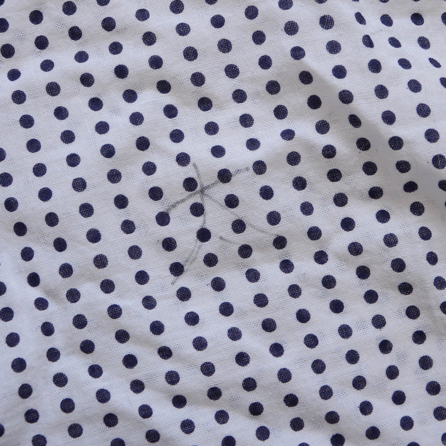 Cute handwritten kanji characters on a traditional Japanese Mameshibori patterned tenugui