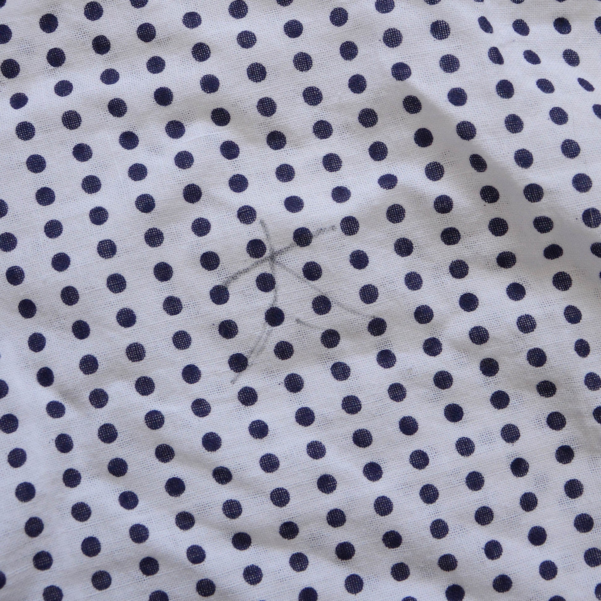 Cute handwritten kanji characters on a traditional Japanese Mameshibori patterned tenugui