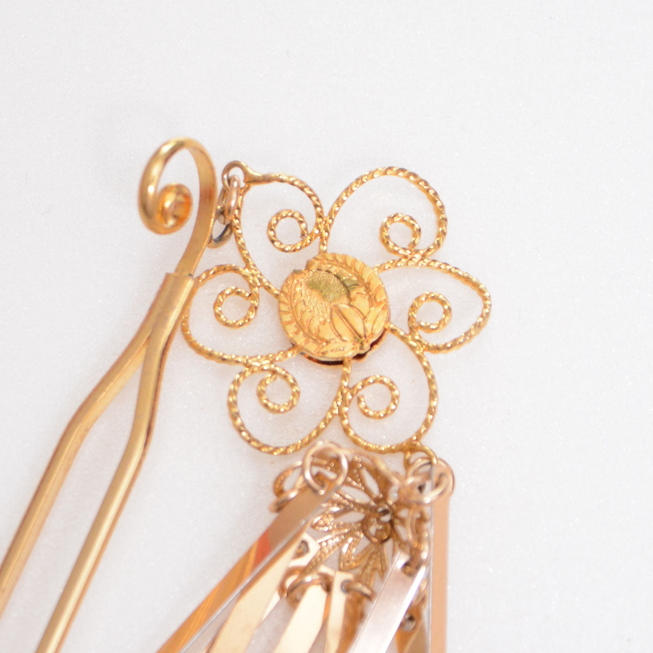 Close-up of detailed metalwork on antique Japanese hair ornament