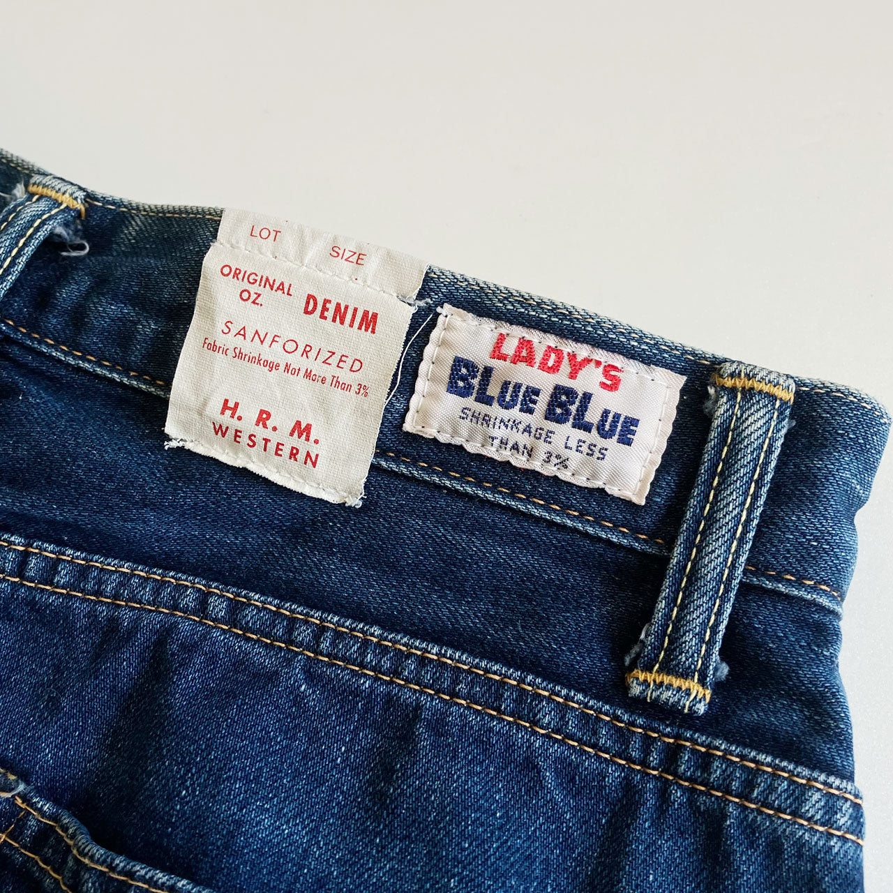 Indigo denim pants featuring distinctive oni-hige whisker fades