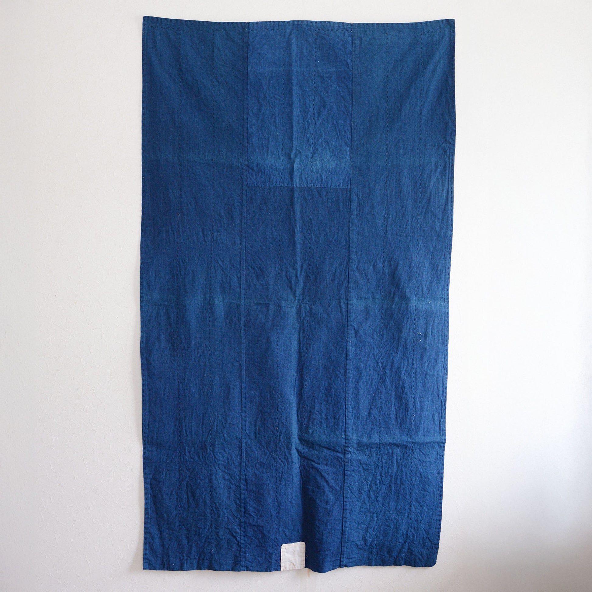 Indigo-dyed Japanese fabric with decorative white accents