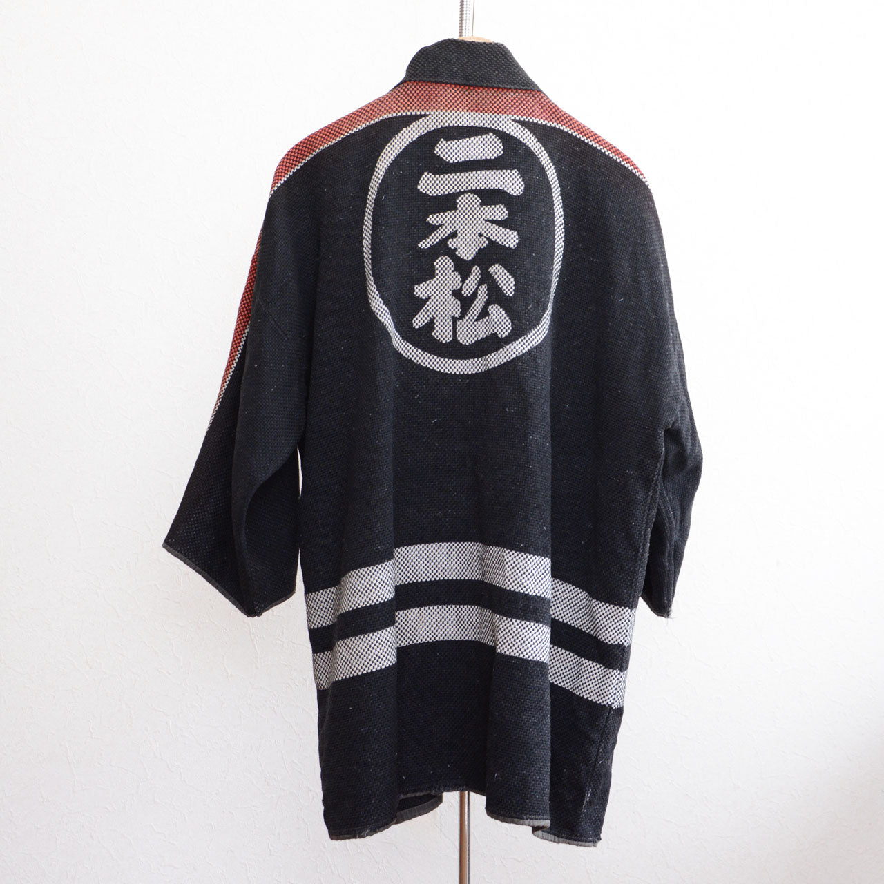 Traditional Japanese hanten with sashiko fabric and white lettering