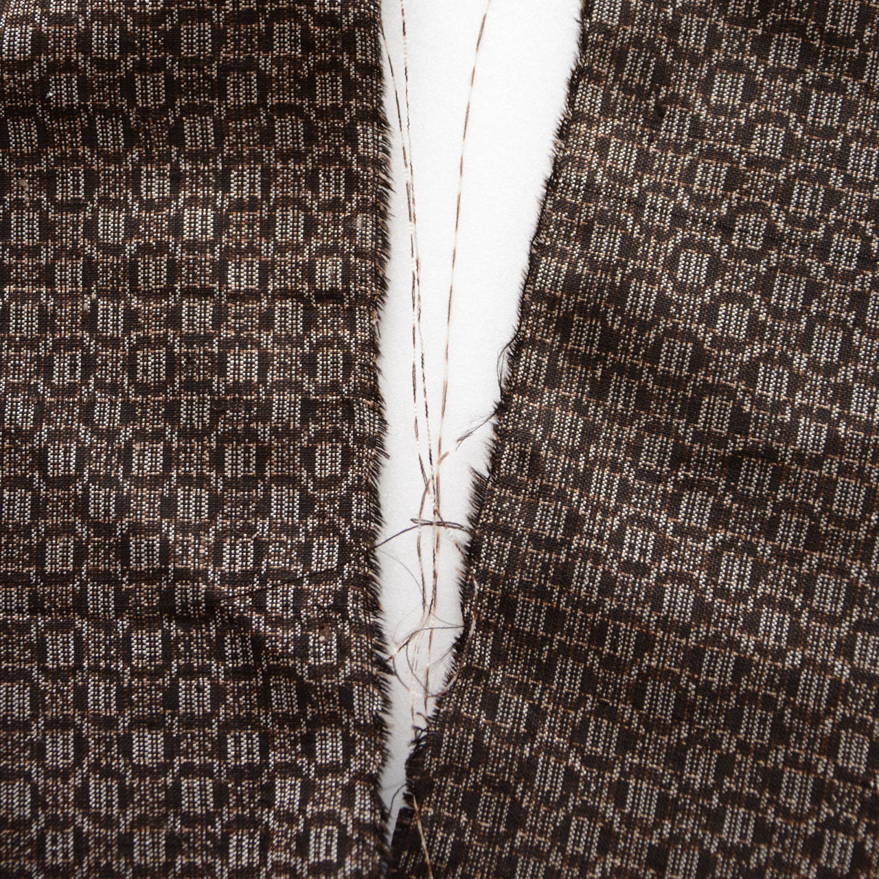 Close-up of traditional tortoiseshell motif on glossy silk fabric