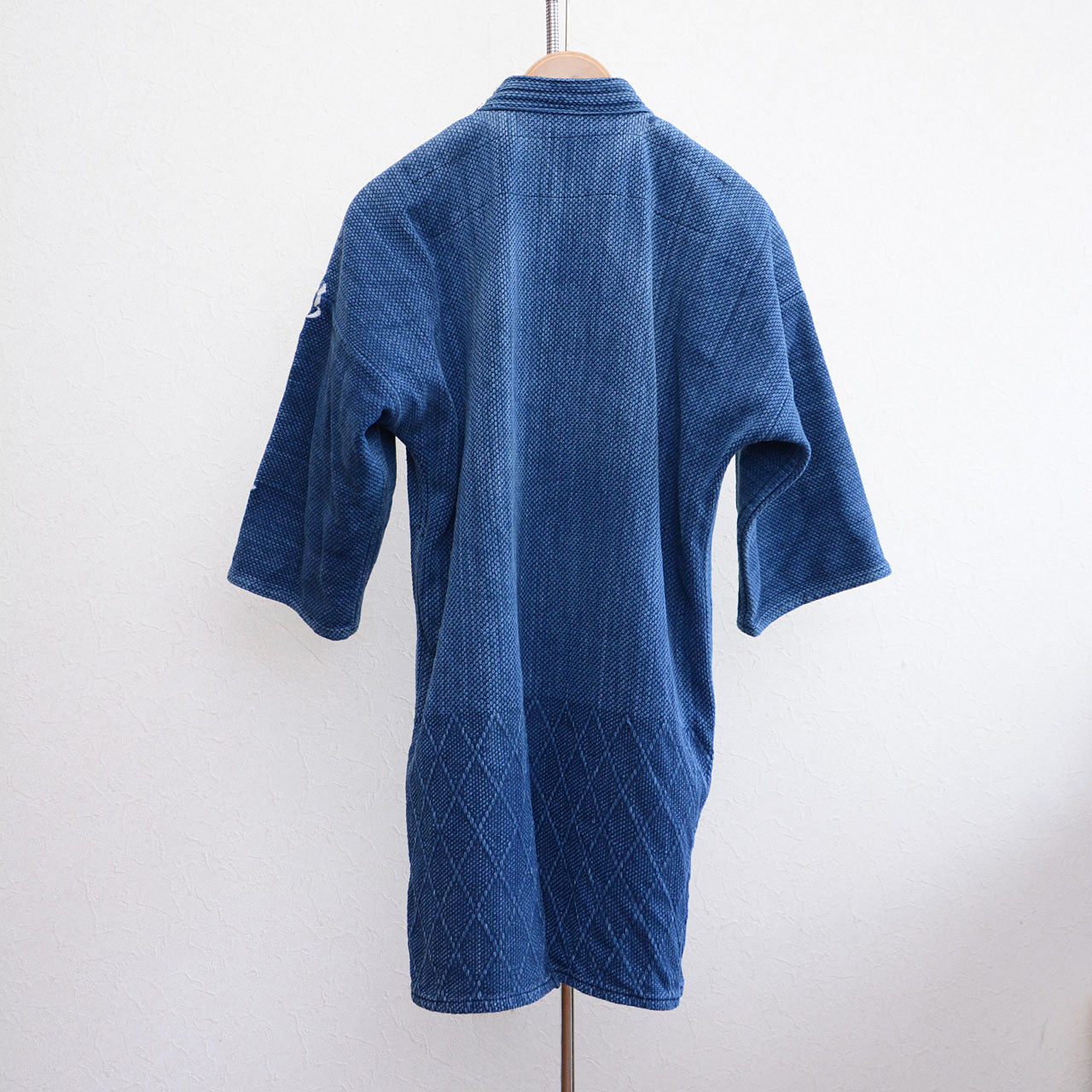 Traditional Japanese kendo jacket featuring textured sashiko fabric
