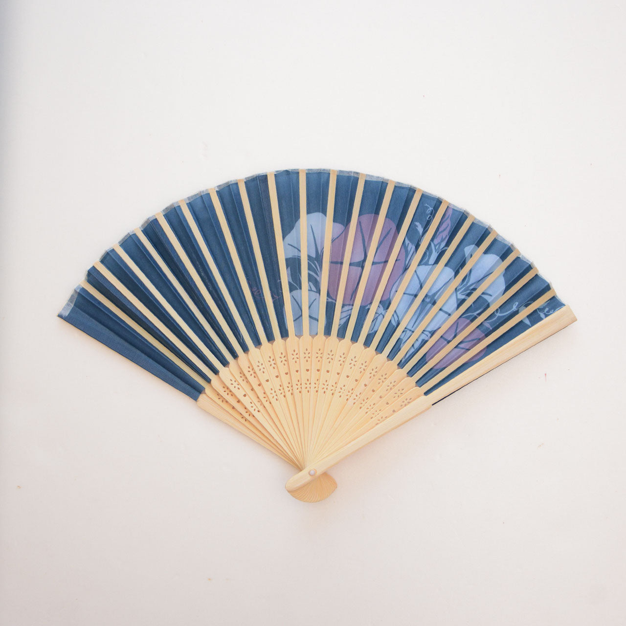 Lightweight bamboo and polyester folding fan with summer floral motif
