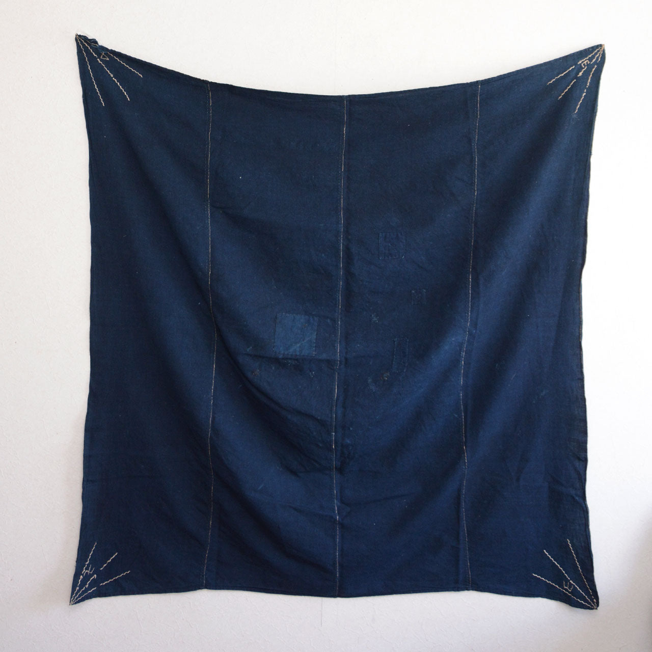 Japanese indigo-dyed cotton cloth with boro texture and rustic beauty