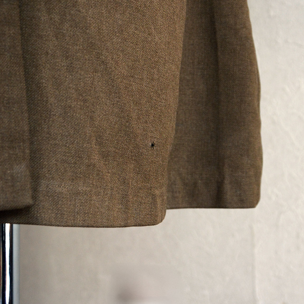 A U.S. Army officer jacket bearing traces of long-term civilian circulation.