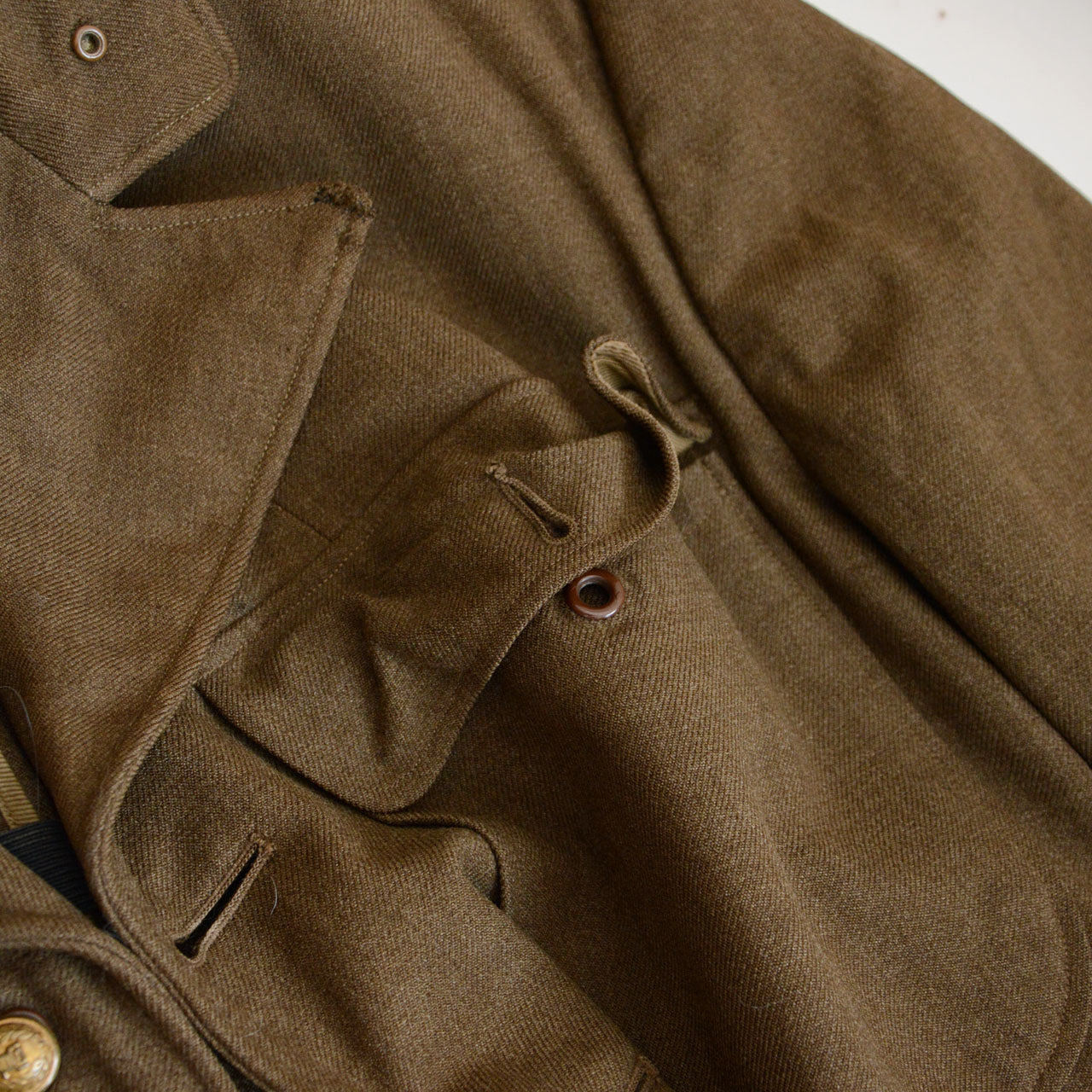 A 1940s officer jacket with altered fastening configuration.