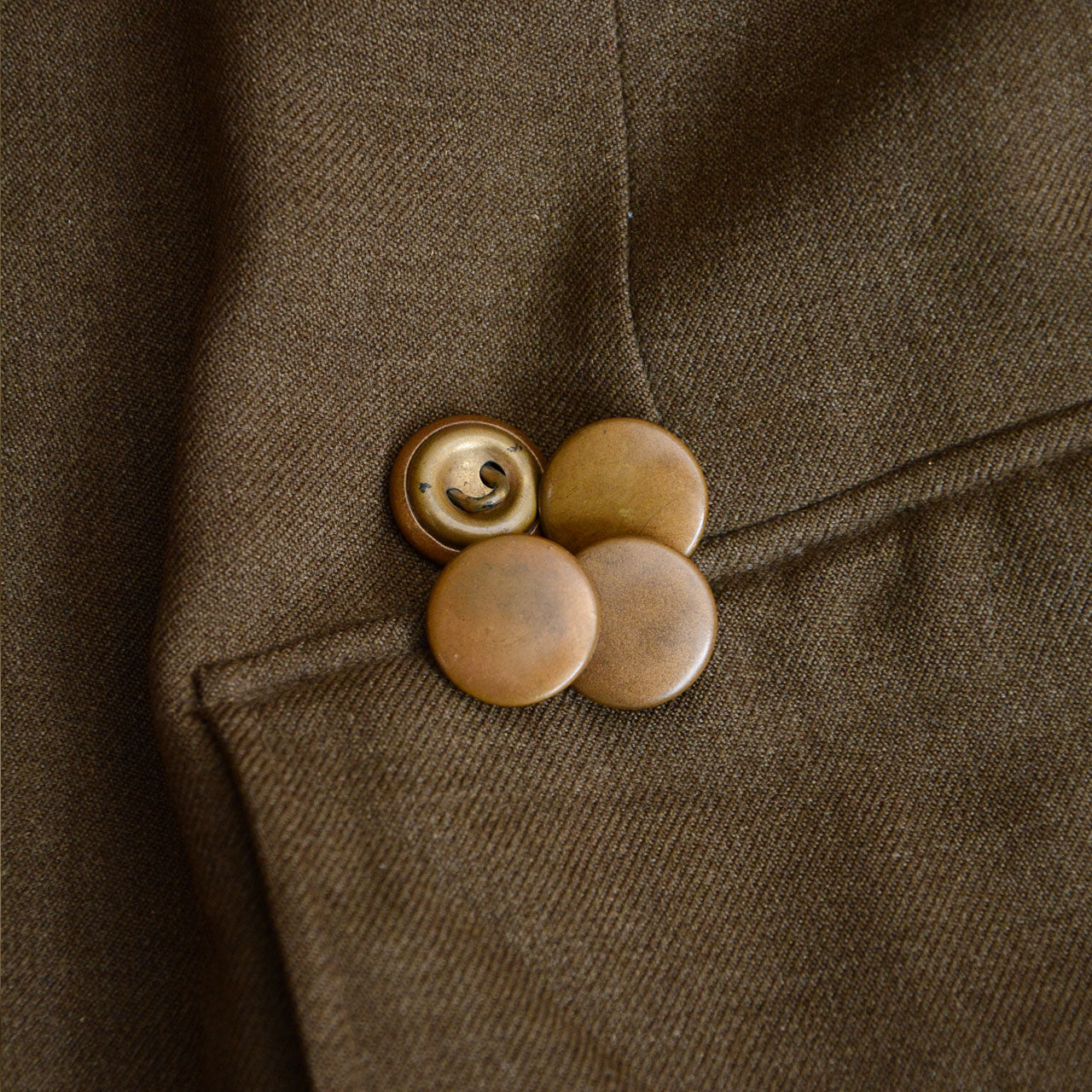 A World War II era officer jacket reflecting postwar reuse practices in Japan.