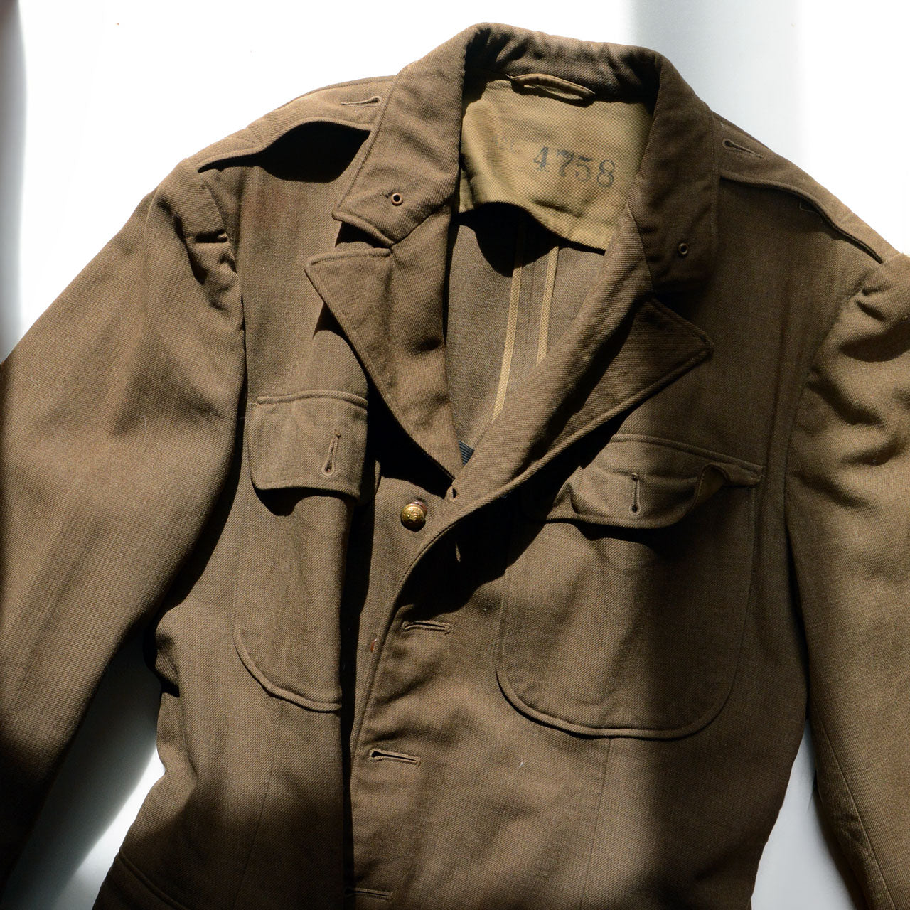 A 1940s U.S. Army officer jacket with complex postwar alteration history.