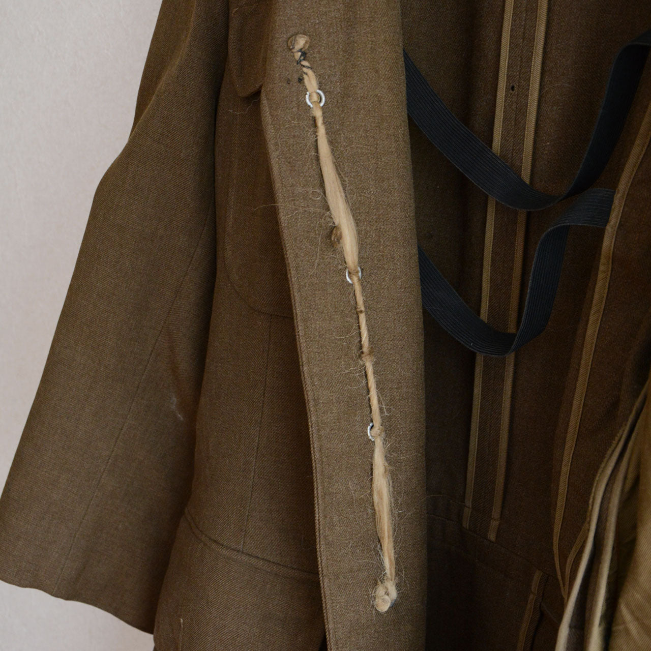 A 1940s U.S. military officer jacket adapted for postwar reuse.