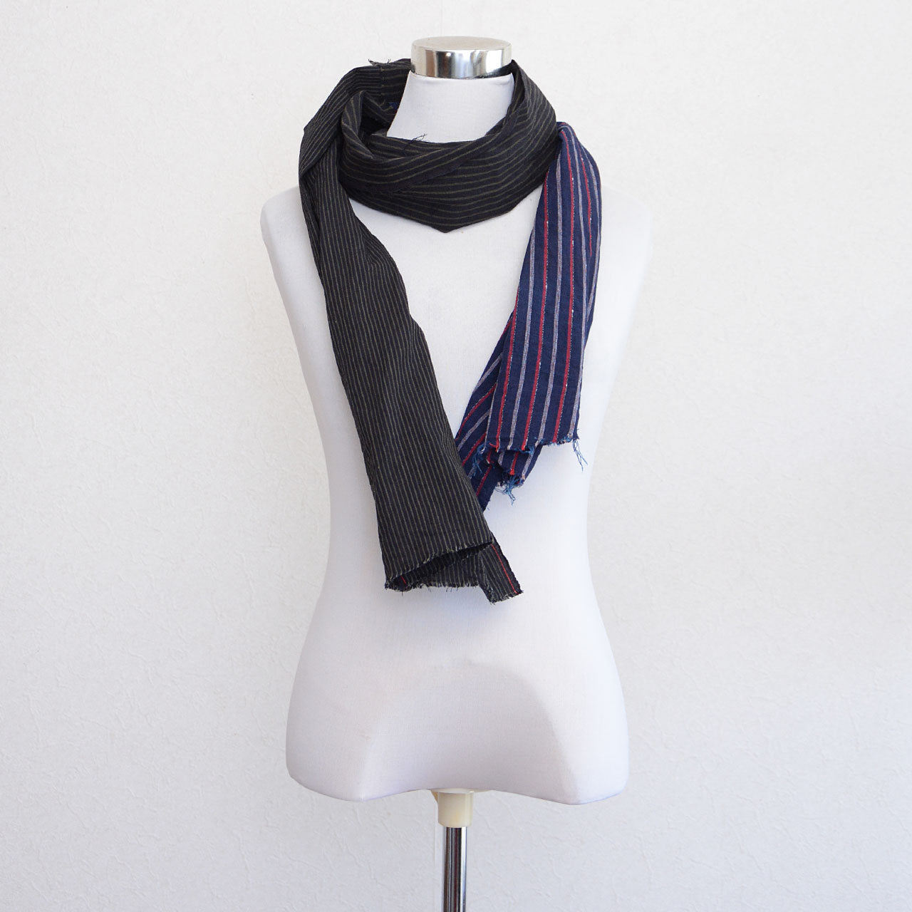 Textured cotton stole with visible stitching and raw edges