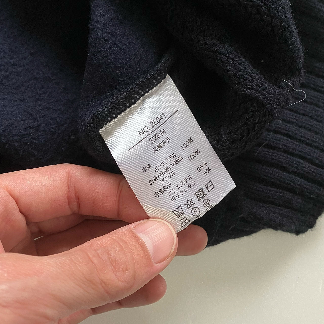 Men’s M knit sweater with multi-pattern patchwork construction