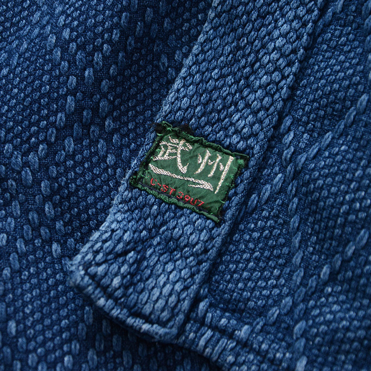 Handcrafted Japanese indigo cotton jacket with detailed sleeve embroidery