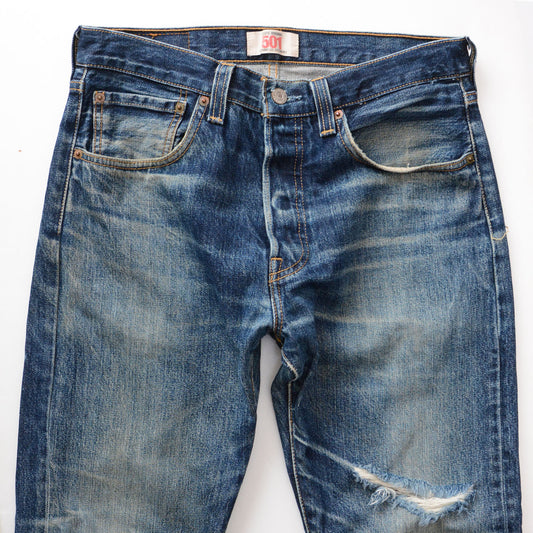 Levi's 501 denim jeans, indigo blue with heavy natural fading, 100% cotton, circa 2009