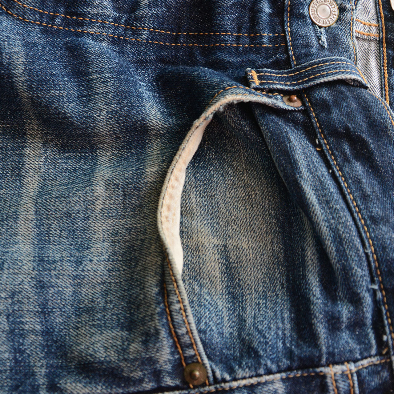 Levi's 501 jeans, thinning fabric at high-wear areas, aged indigo denim, 2009