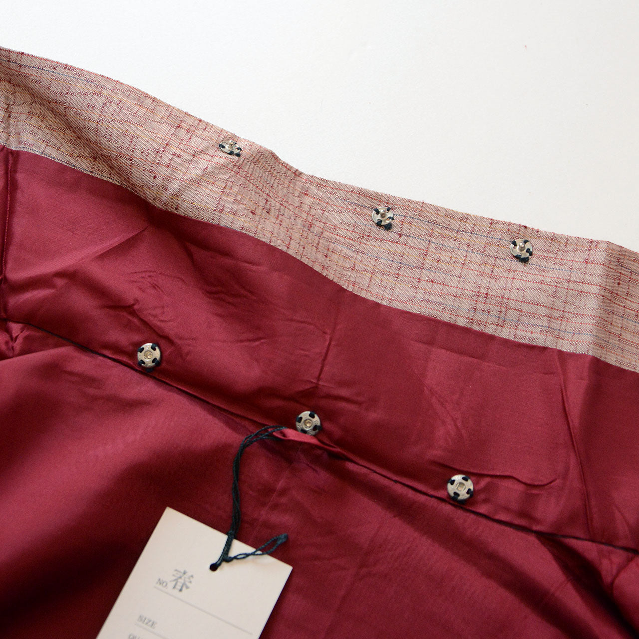 Soft pink haori jacket with subtle woven patterns