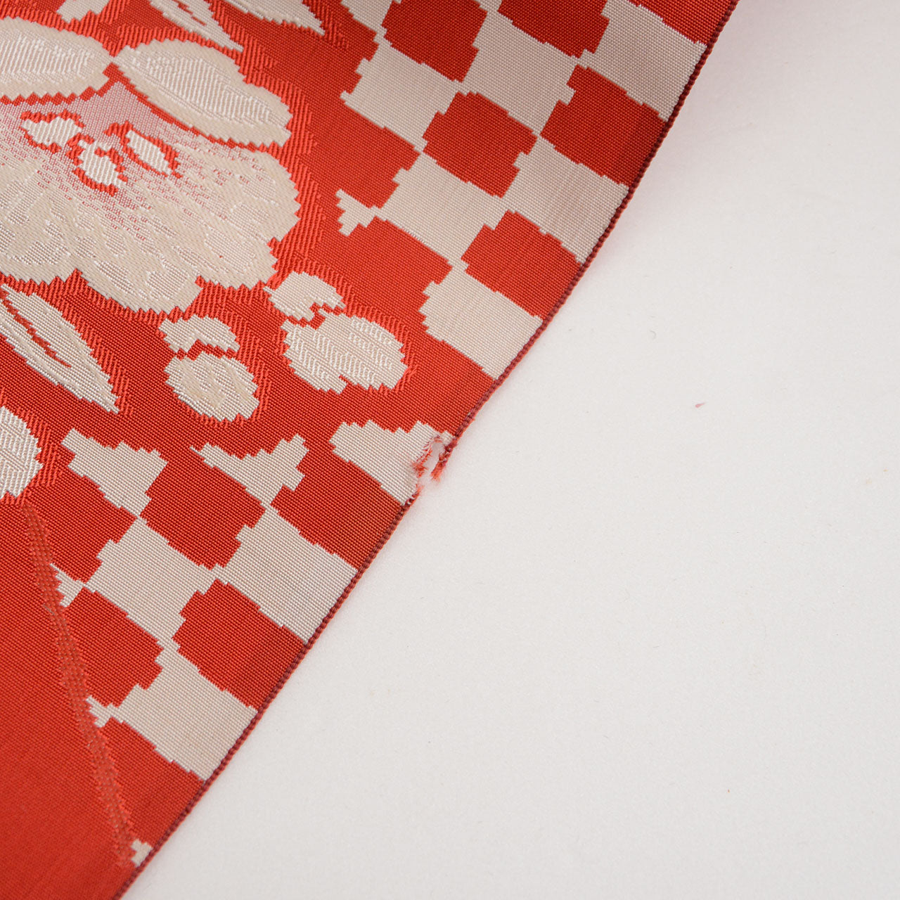 Japanese silk obi with repeating floral and checkered pattern