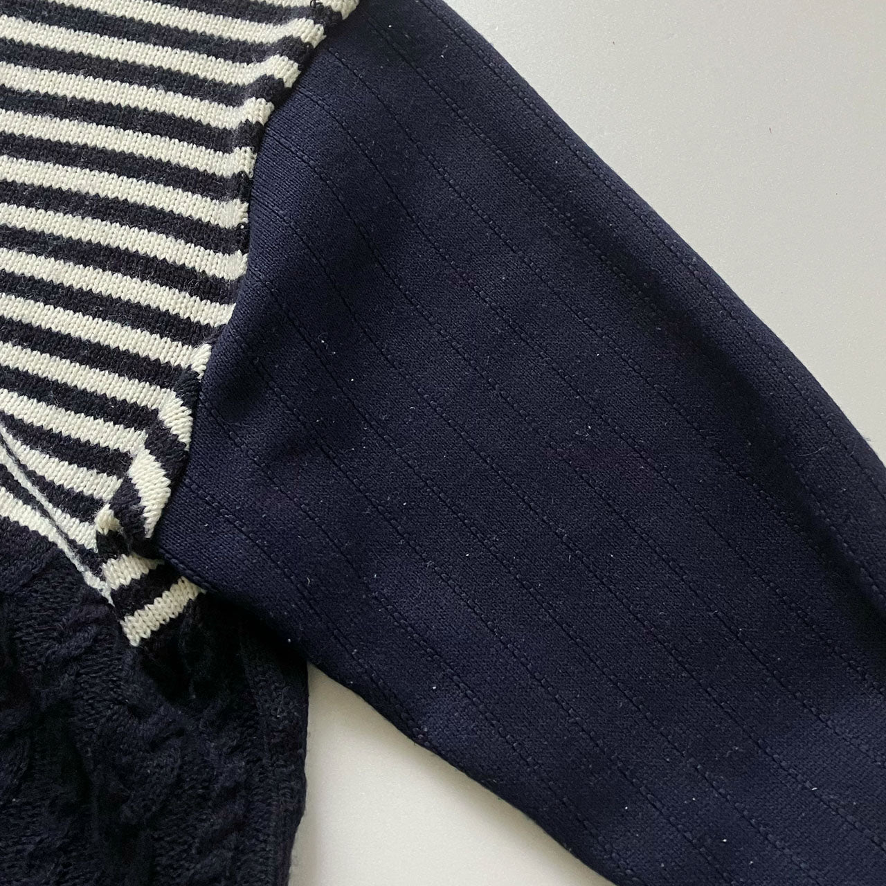 Cozy cable knit sweater with bold mixed textures