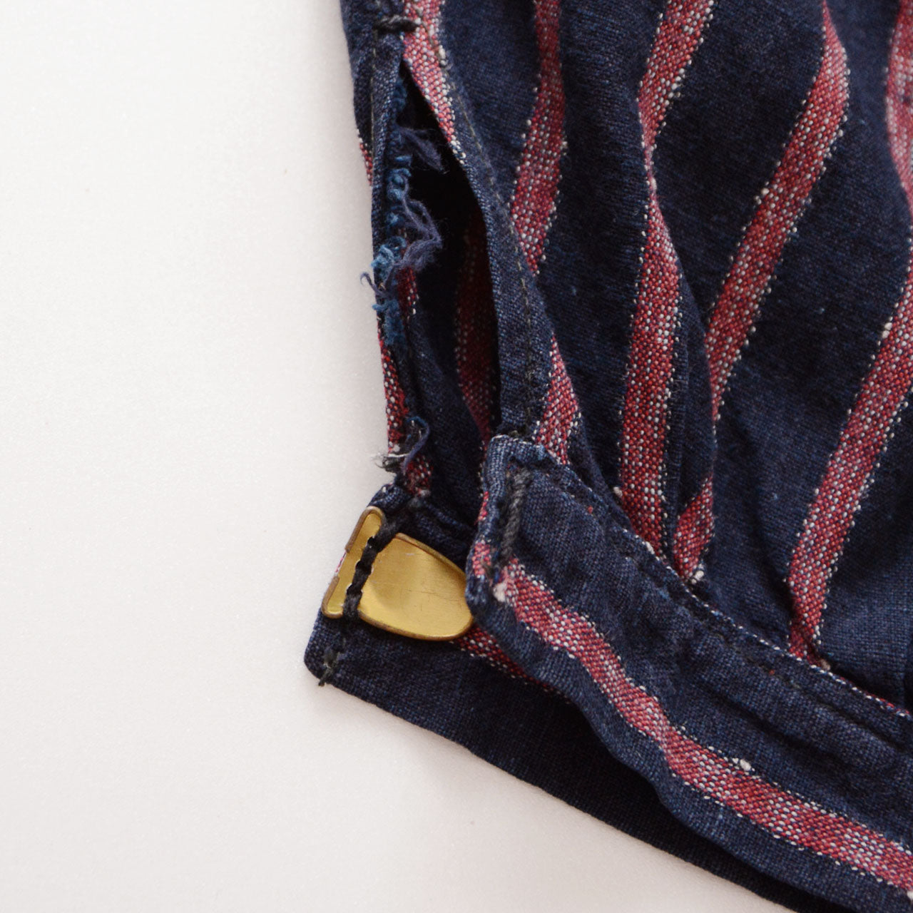 Sustainable vintage monpe with visible repairs and metal clasp closures