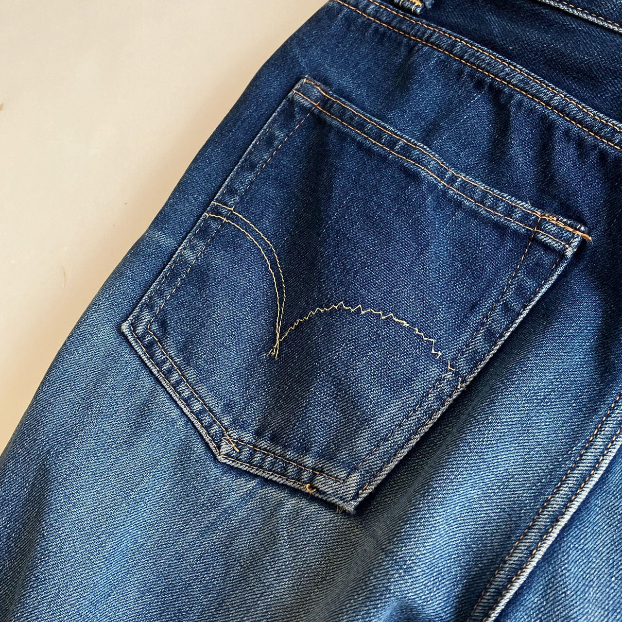 Pre-washed BLUE BLUE denim showing natural fading
