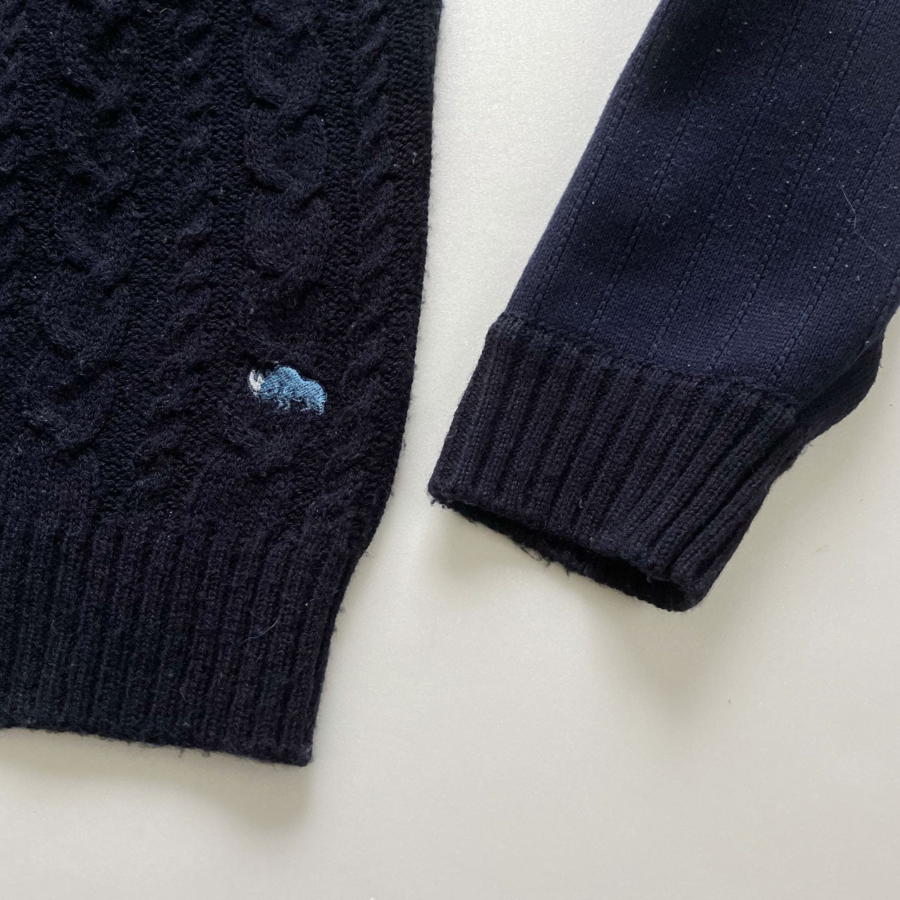 Soft knit sweater featuring creative patchwork design