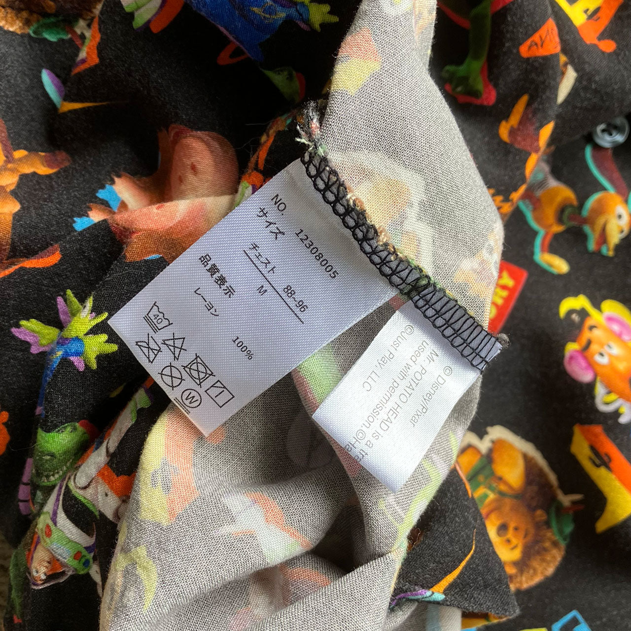 All over print Toy Story aloha shirt, black rayon, vintage Disney Pixar collectible, Japan market, size M