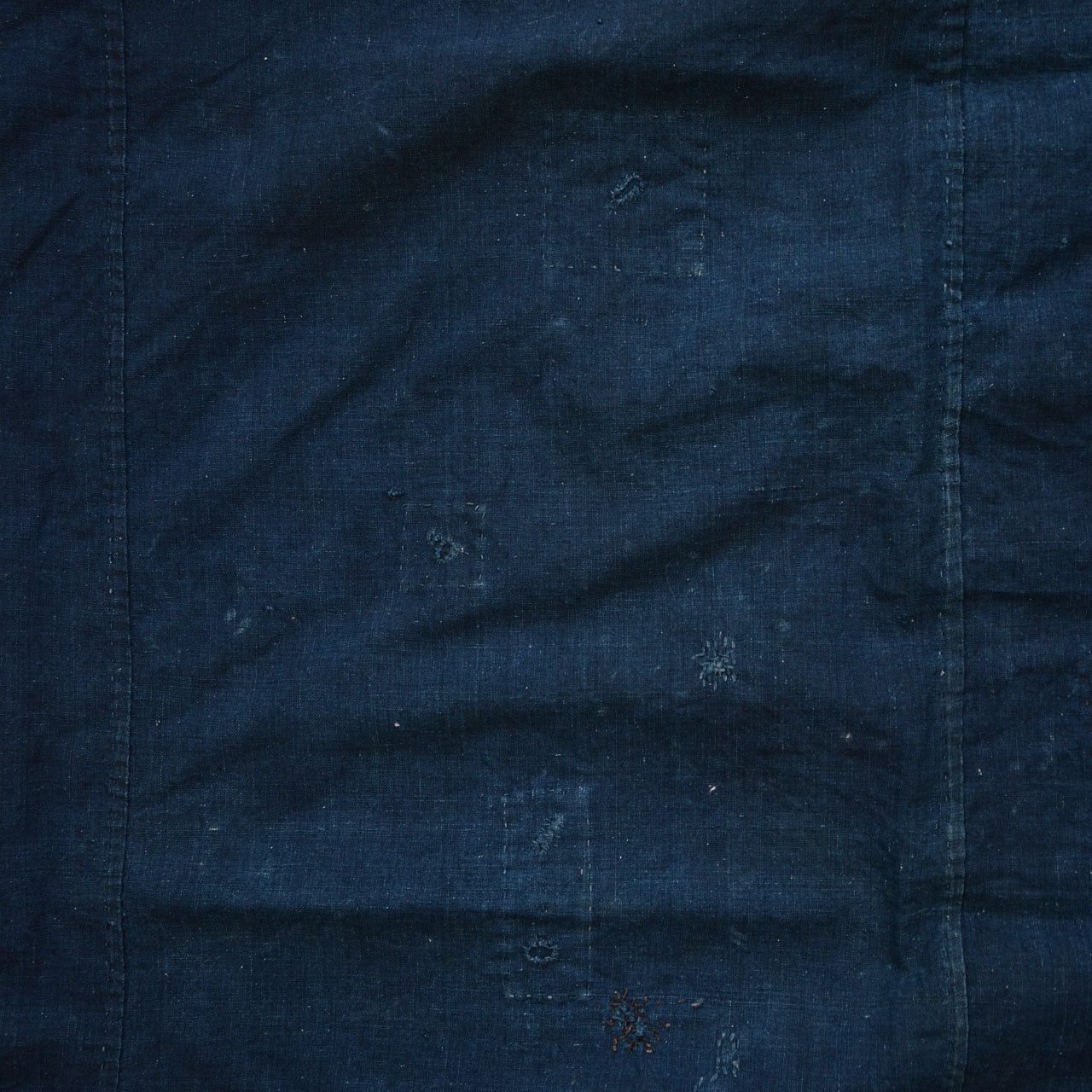 Wabi-sabi aesthetic Japanese cloth with natural wear and repairs