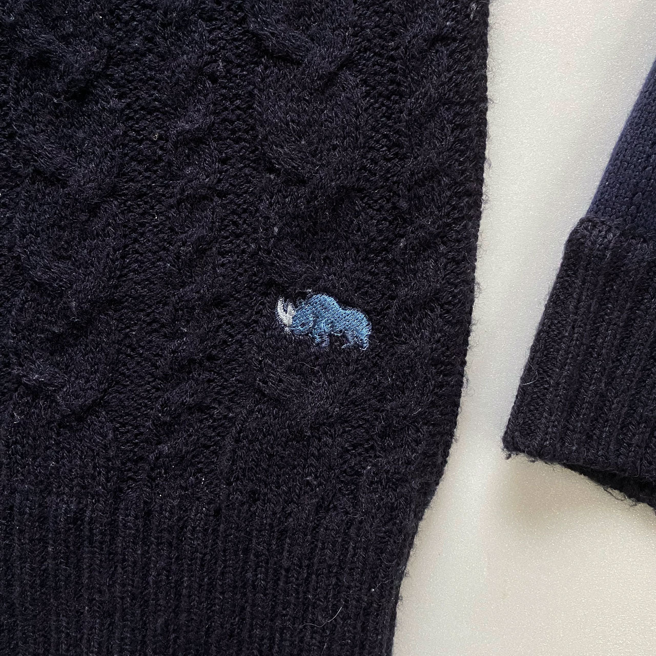 Designer knitwear with expressive mixed knit patterns