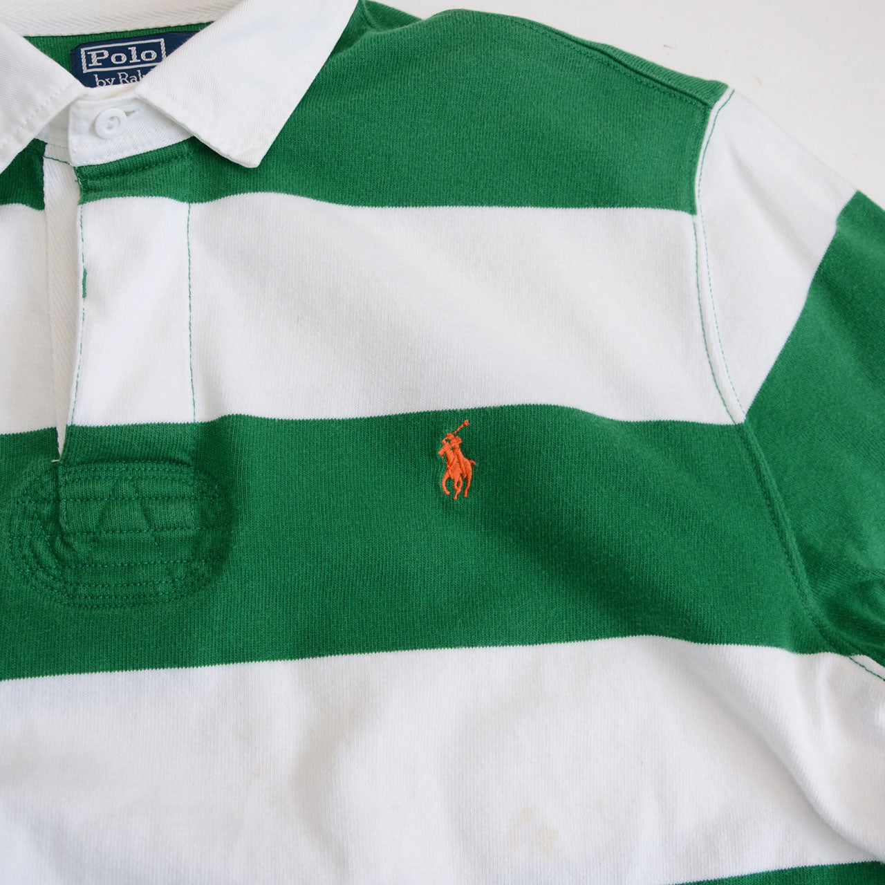 A vintage striped rugby shirt produced in the 1990s by Ralph Lauren