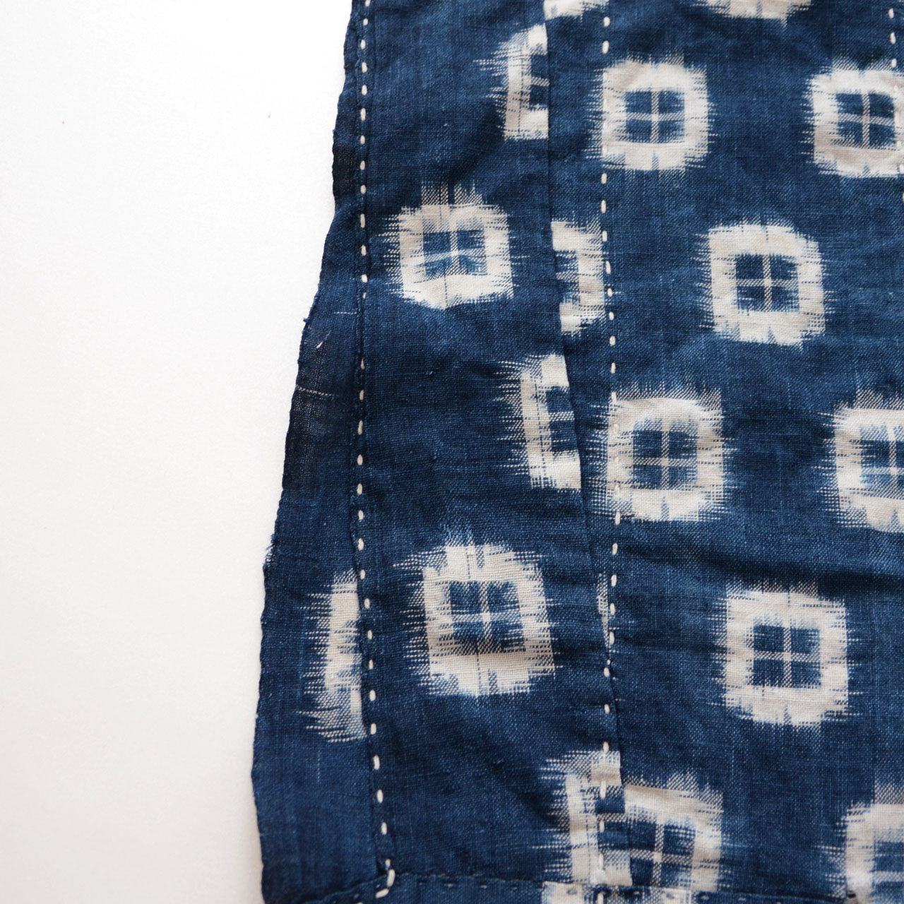 Authentic Japanese blue kasuri cotton with repaired and patched areas