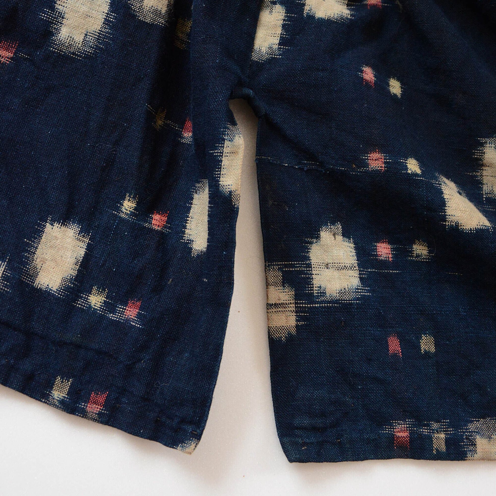 Side slit detail of a noragi, showcasing its traditional design and functionality