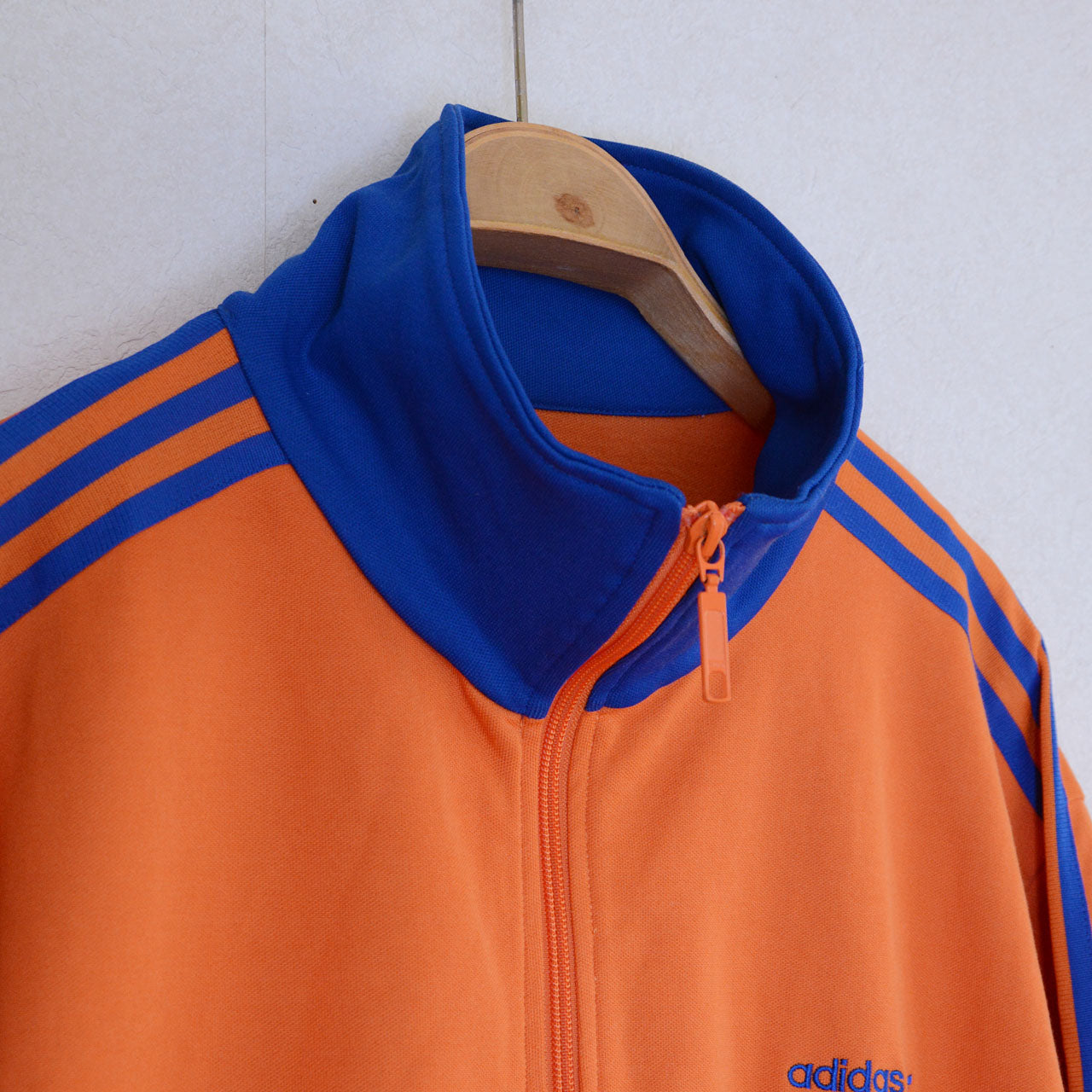 adidas 3-stripe track jacket, orange body, royal blue trim, cotton polyester blend