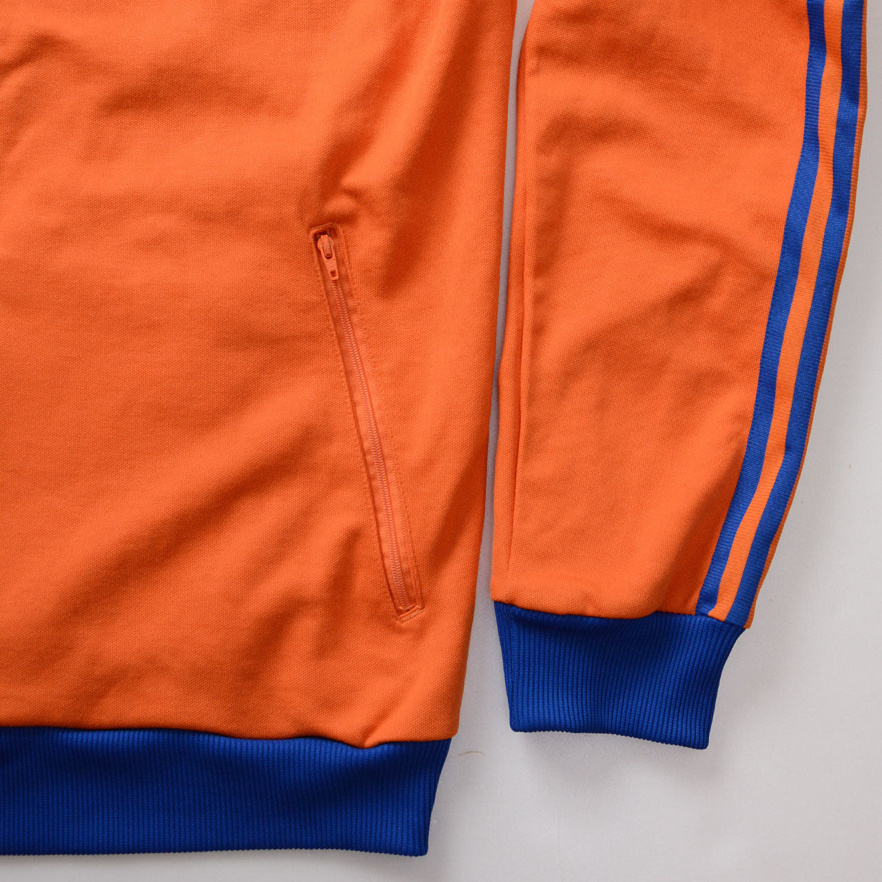 adidas orange track jacket, royal blue collar, 3-stripes on sleeves, trefoil logo