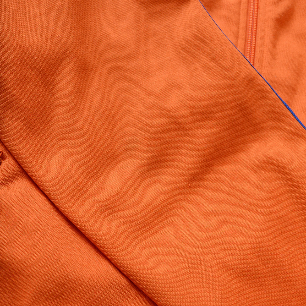 adidas 3-stripe zip jacket, orange body, royal blue ribbed details, trefoil logo