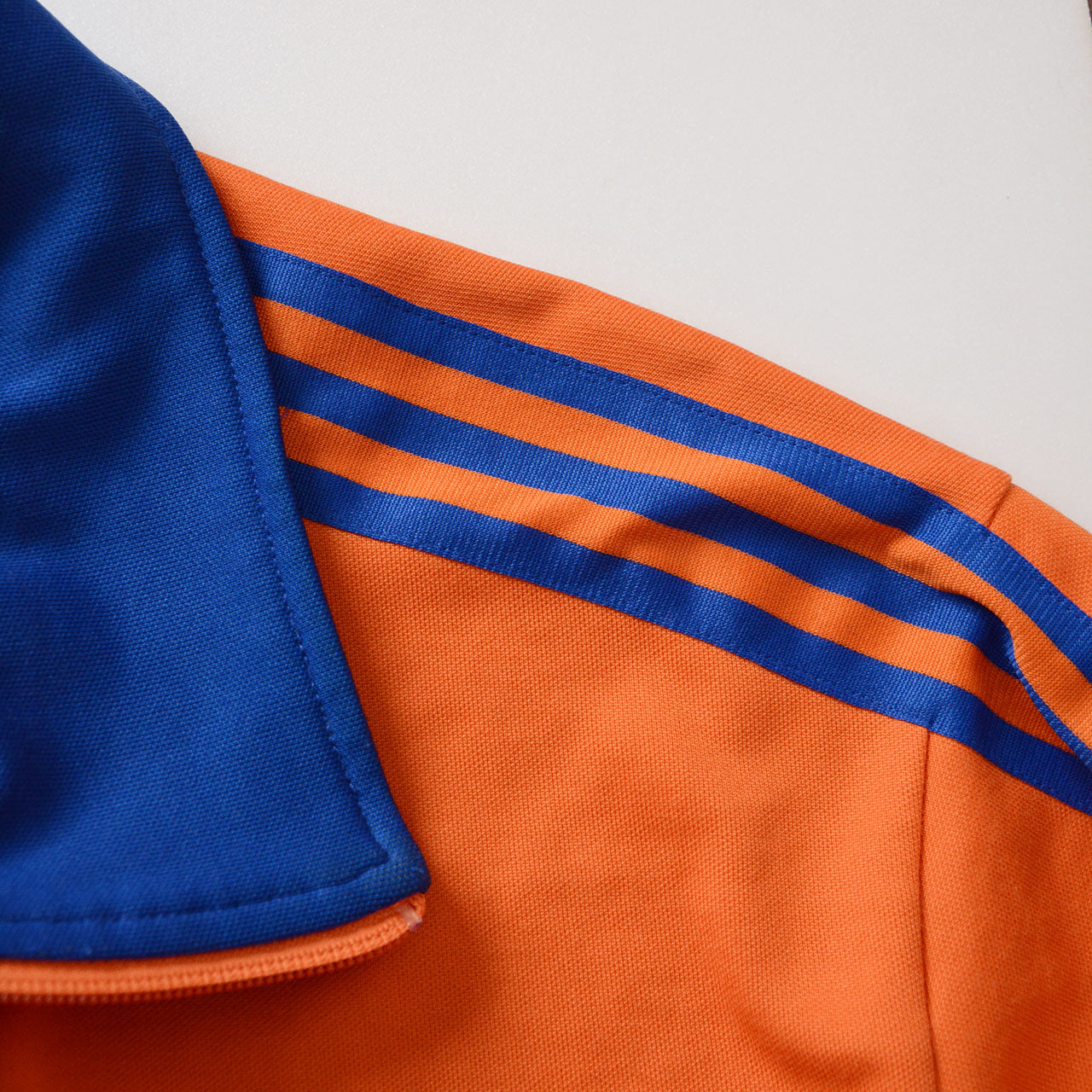 adidas track jacket, orange, royal blue stripes, ribbed cuffs and hem, zip pockets