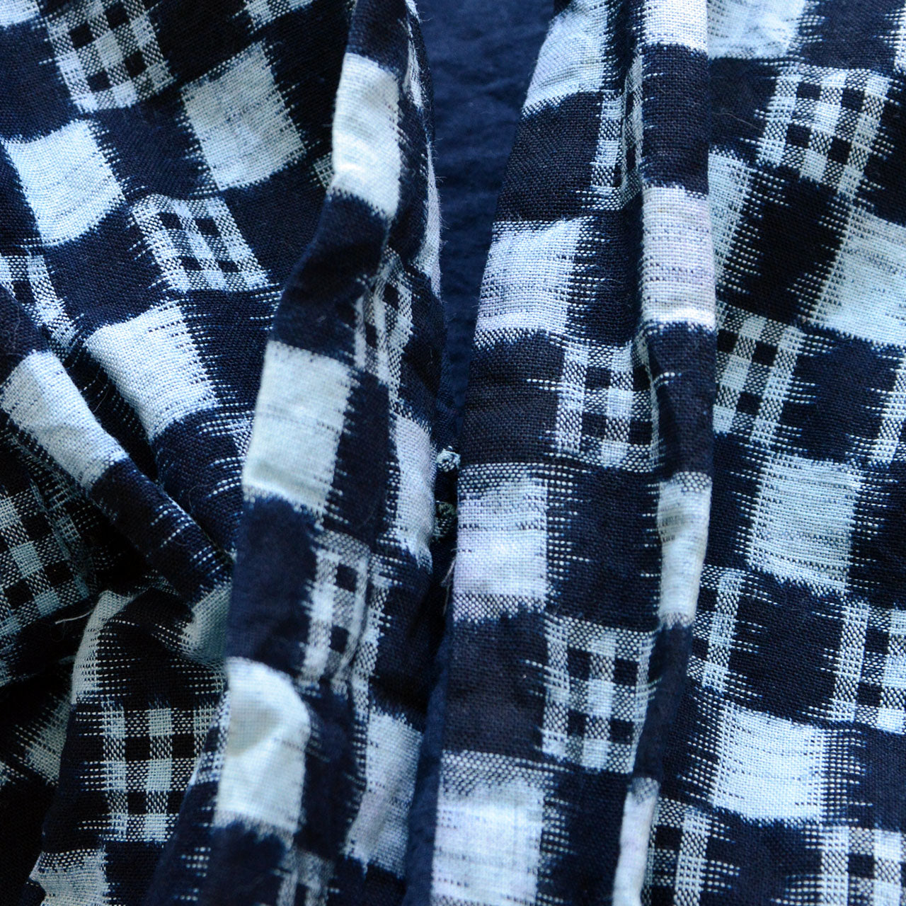 Japanese folk textile haori, indigo-dyed plaid kasuri weave, circa 1920s–1940s