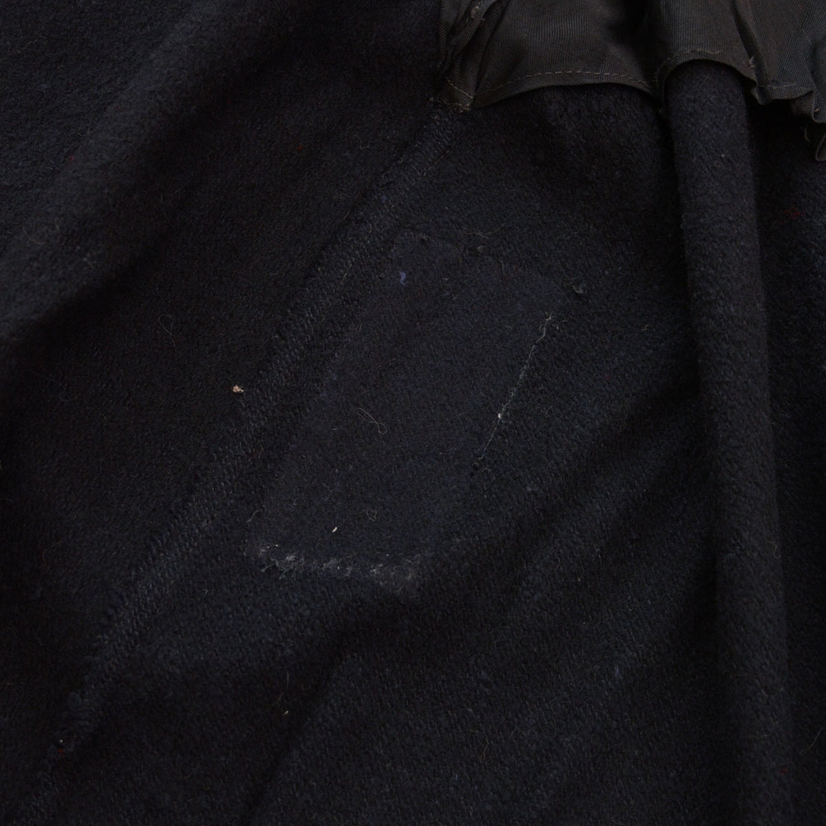 Trace of a removed name label inside black wool Bankara mantle