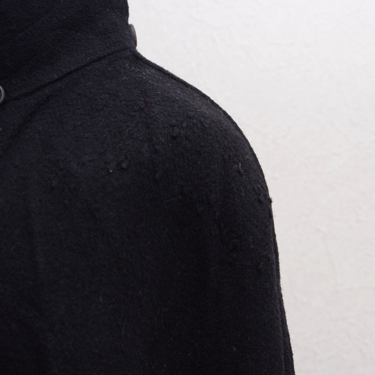 Frayed area around shoulder of Japanese vintage black wool Bankara mantle