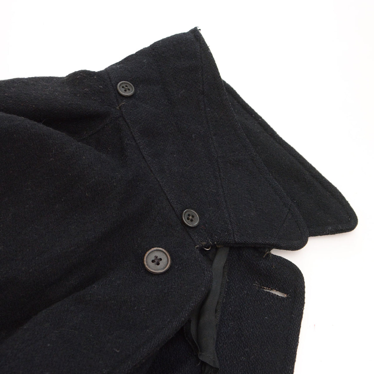 Reverse side of collar with hood attachment buttons on black wool Bankara mantle