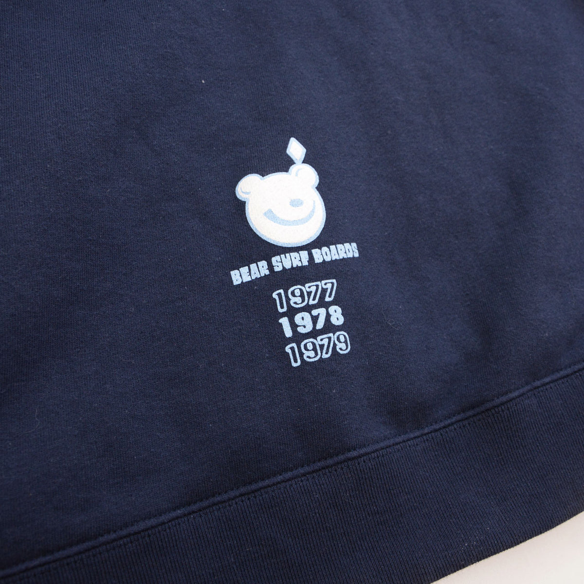 Bear graphic and 1977, 1978, 1979 print near the back hem of BEAR hoodie