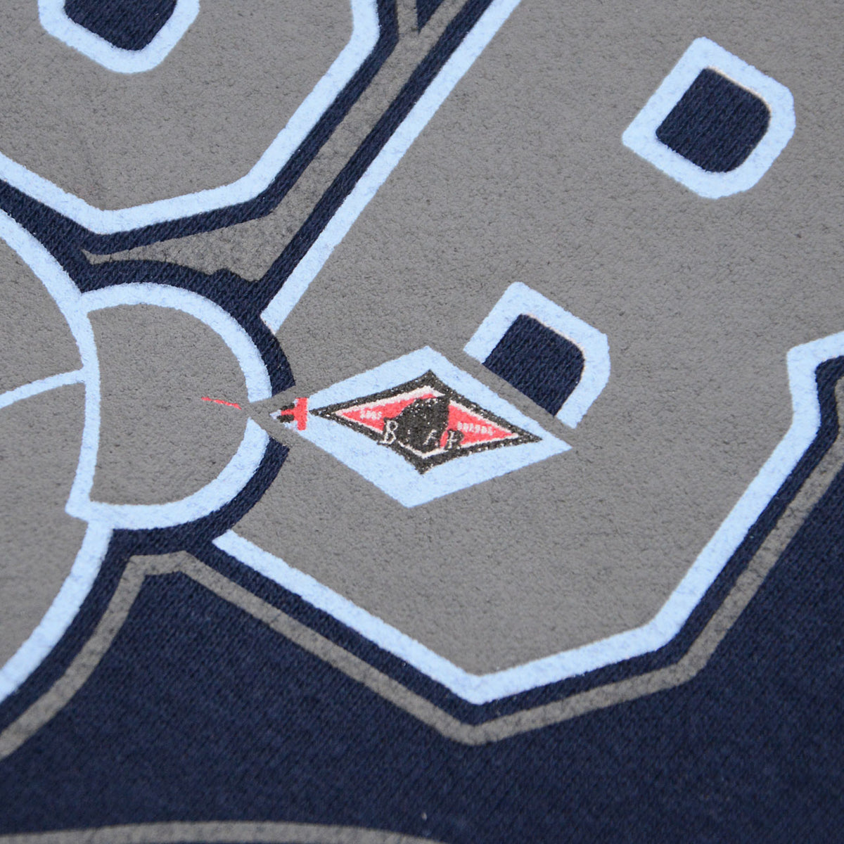 Small BEAR logo within the BSB graphic on navy hoodie