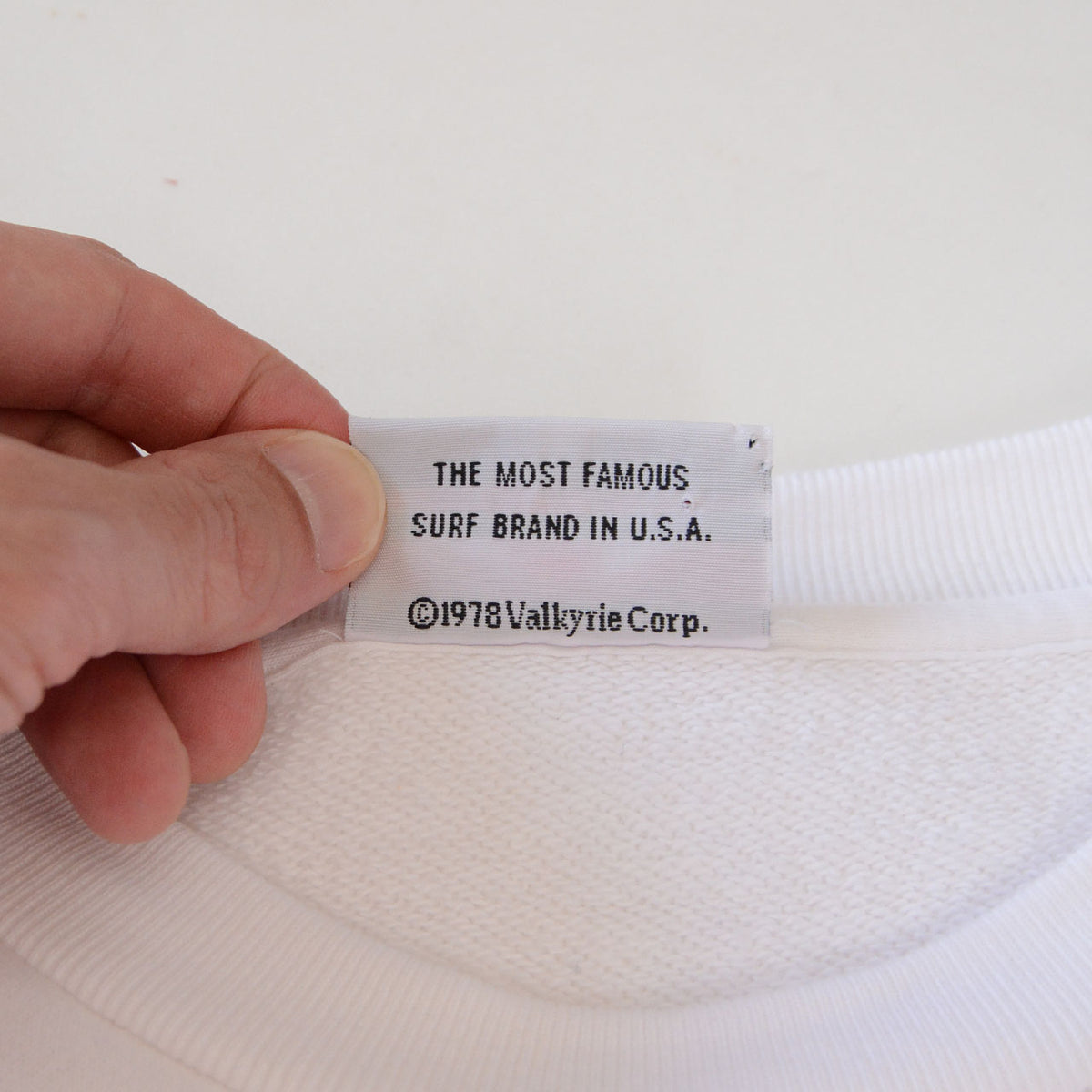 Reverse of BEAR SURFBOARDS neck label with Valkyrie Corp copyright text