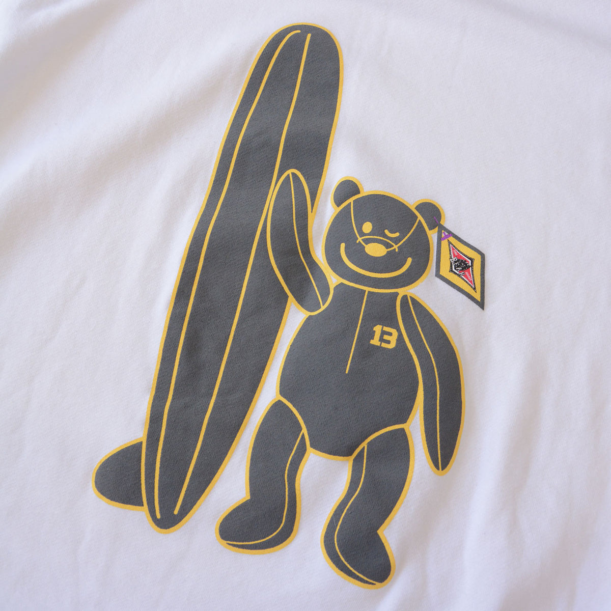 Winking bear and surfboard graphic on white BEAR SURFBOARDS sweatshirt