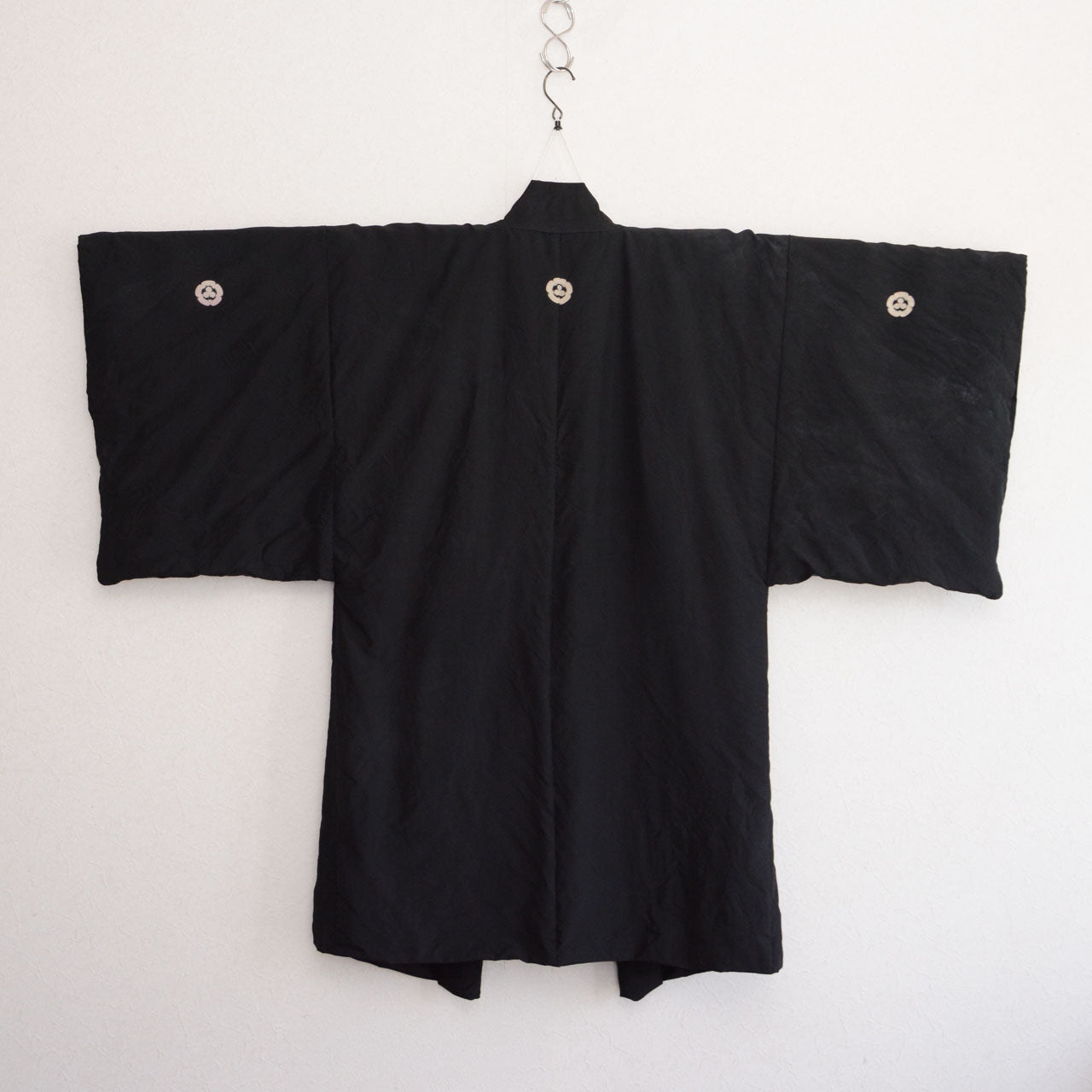Vintage Japanese haori in black silk, five family crests, late Showa period